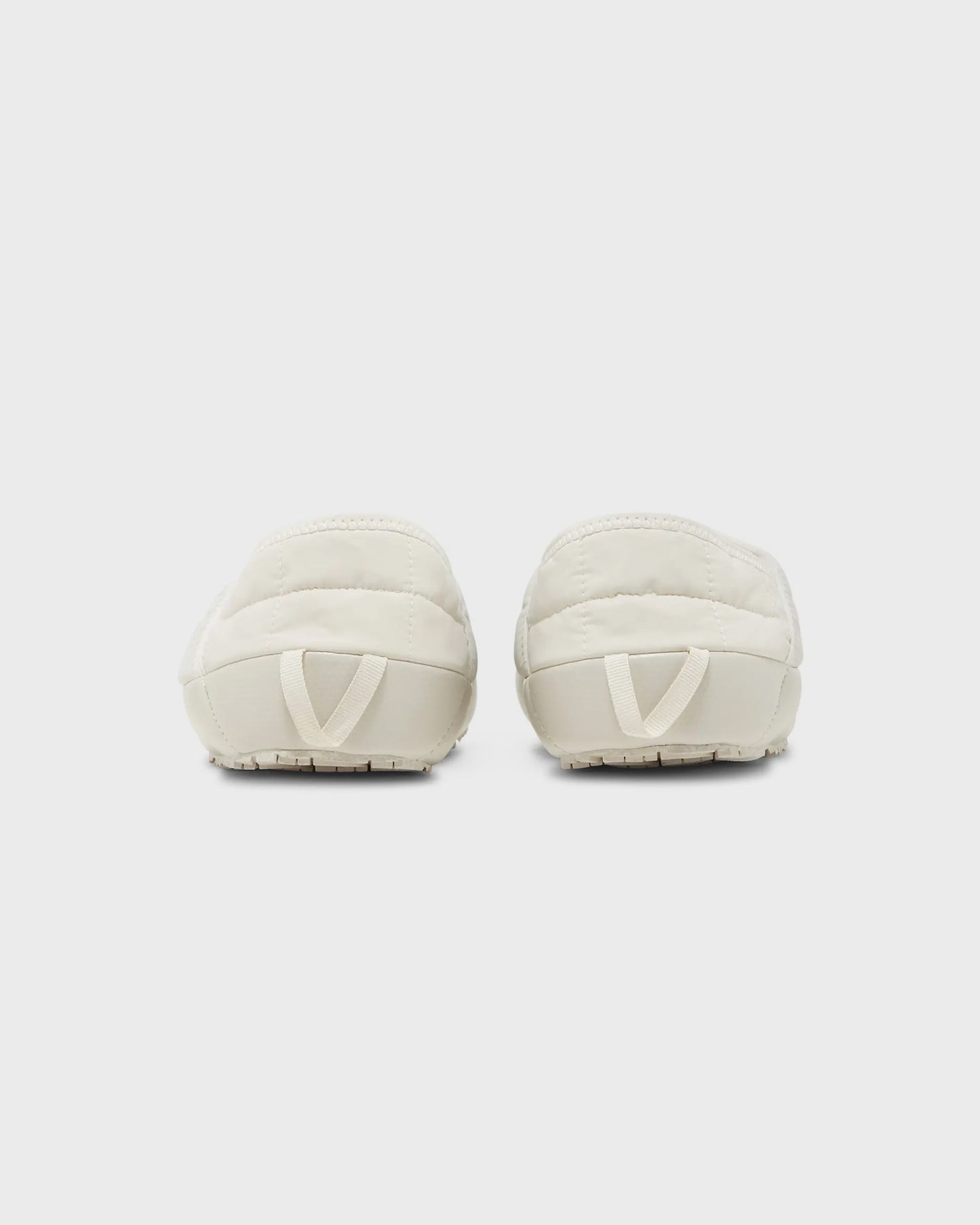 The North Face KAWS x ThermoBall Traction Mule VS Moonlight Ivory Orange